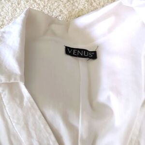 Shoelace neckline dress. White 3/4 sleeves. Mid length. Gorgeous on. Size medium